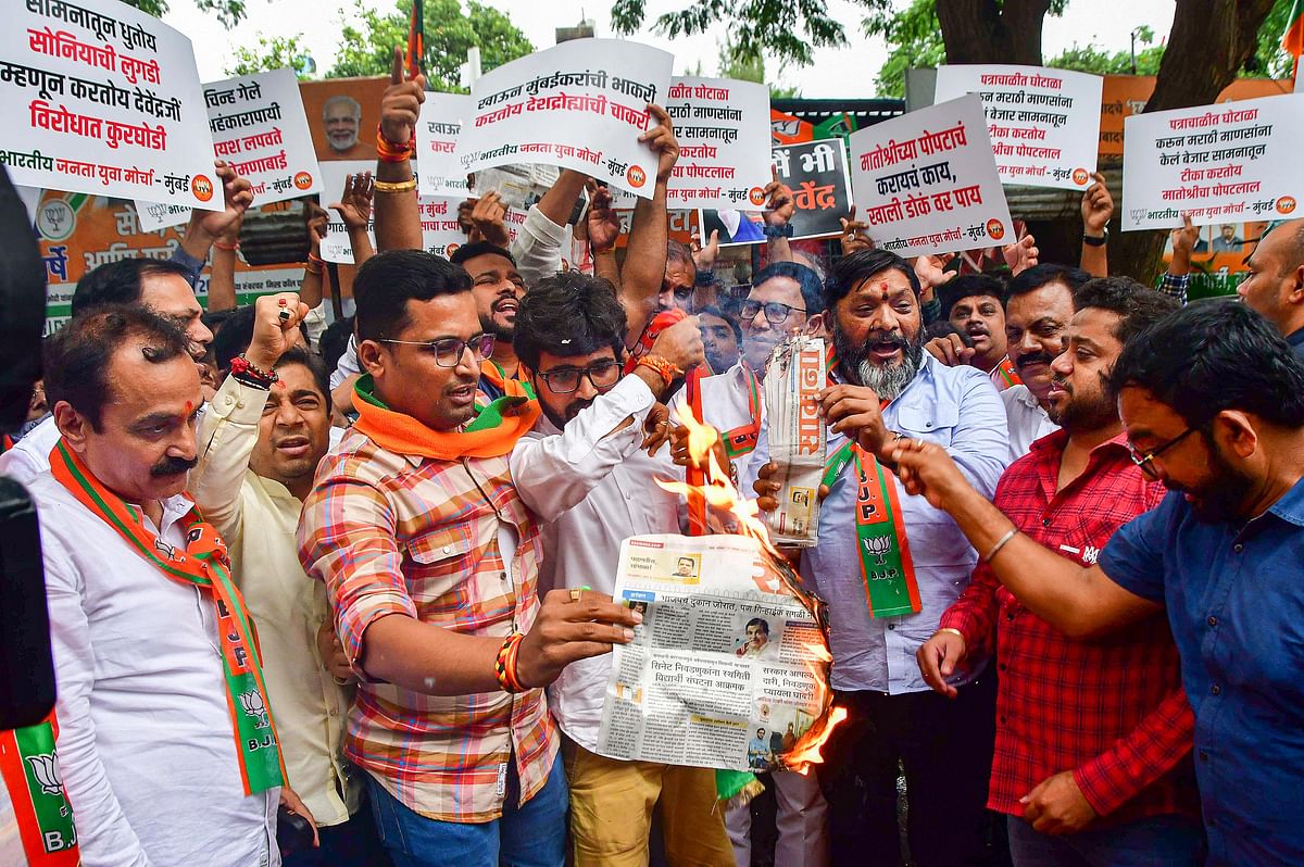 Mumbai: Members of Bharatiya Janata Yuva Morcha protest against Shiv Sena (UBT) mouthpiece 'Saamana' and former Maharashtra CM Uddhav Thackeray over an editorial targeting Maharashtra Deputy CM Devendra Fadnavis, in Mumbai, Saturday, Aug. 19, 2023. 