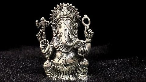 Silver idol of Lord Ganesha, sacred symbols, stolen from Thane temple