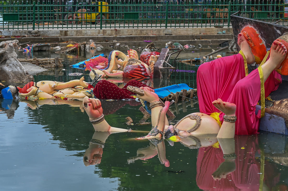 Ganesh idols immersed in the lake. 