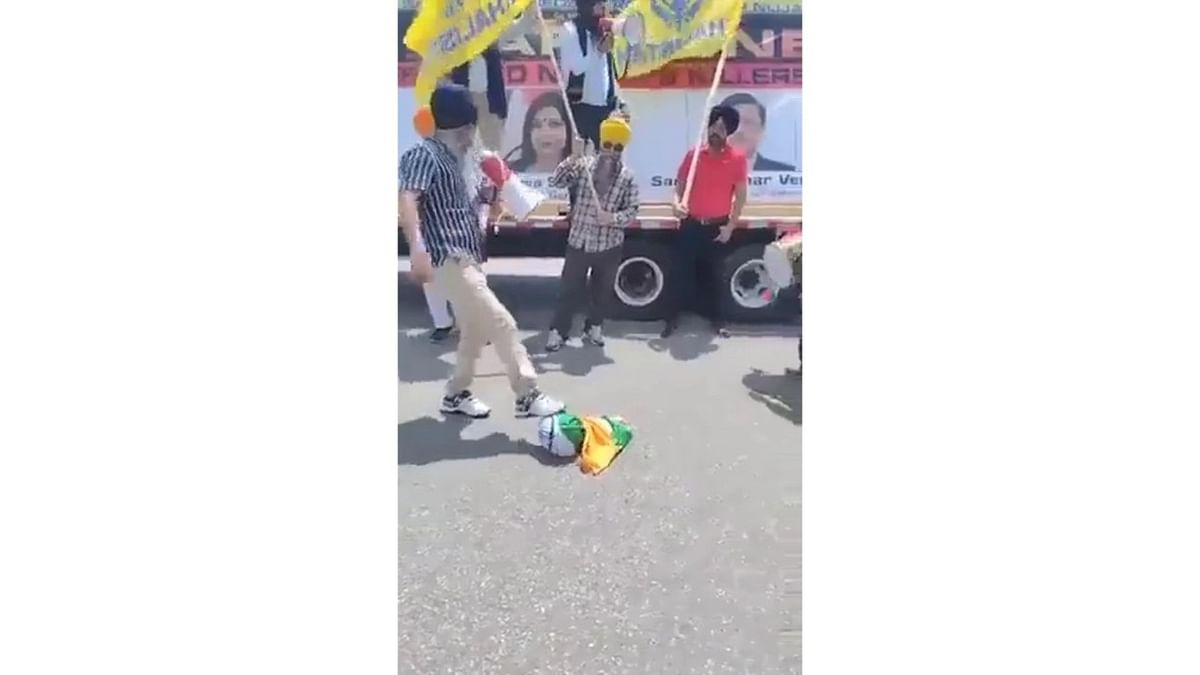 Screengrab from a video of the incident, where Khalistani supporters can be seen disrespecting the Tricolour.