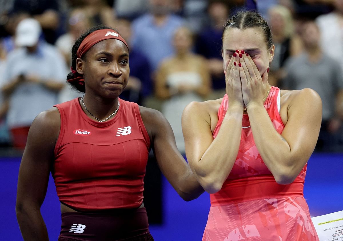 Second place Belarus' Aryna Sabalenka reacts next to Coco Gauff of the US after Gauff won the US Open.