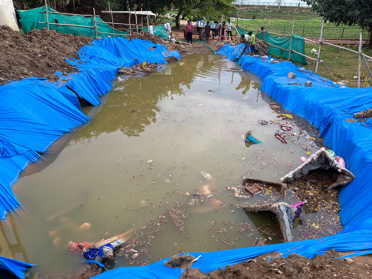 Staff clean up a makeshift pond created for the immersion of Ganesha idols in Vibhutipura Lake. (Left) Ganesha idols being immersed in Halasuru Lake. DH PHOTOs/PUSHKAR V