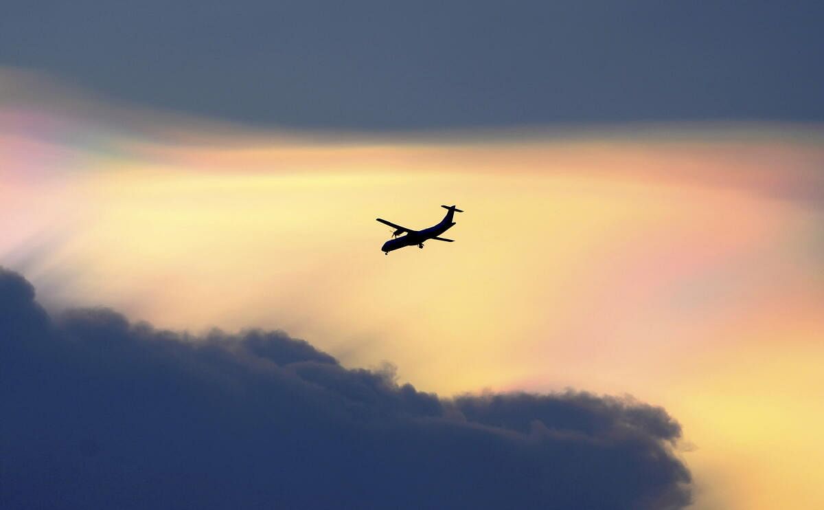 The silhouette of an airplane is seen in Chennai.