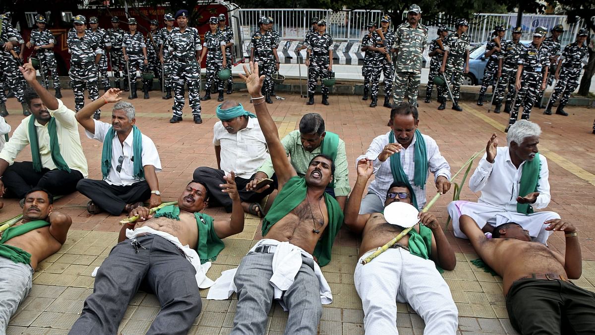 Farmers stage a protest during a 'bandh' called by farmers and Kannada organisations against the release of Cauvery river water to Tamil Nadu from dams in Karnataka, in Bengaluru.