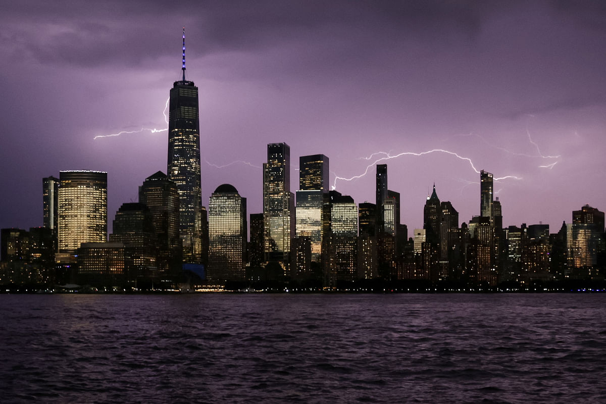 Lightning is seen behind the One World Trade Center on the day of the 22nd anniversary of the September 11, 2001 attacks on the World Trade Center.