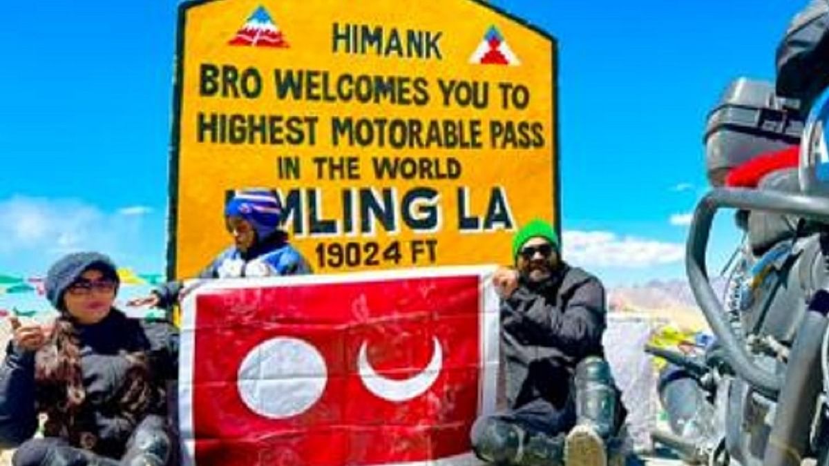 Couple, child from Sullia scale Umling La pass in Himalayas