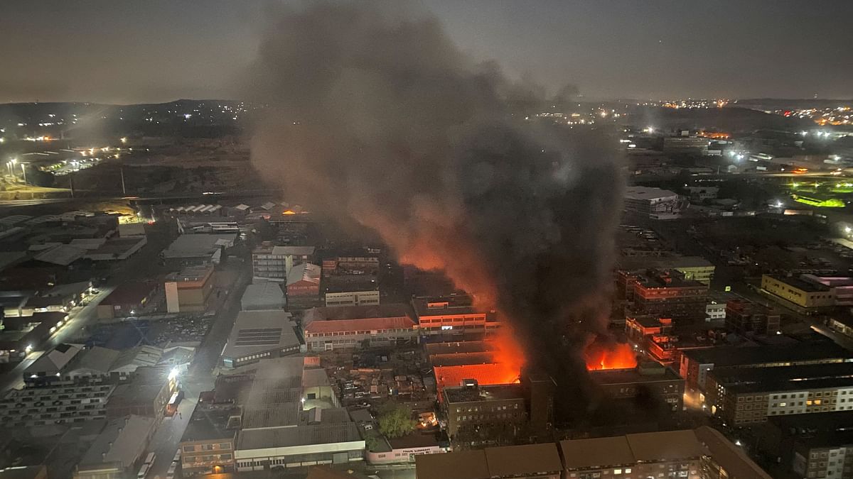 Smoke rises from a burning building amid a deadly fire, in Johannesburg, South Africa, August 31, 2023, in this image obtained from social media.  