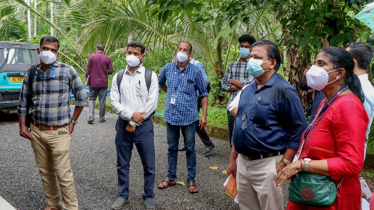 Health workers collect clinical samples and investigate the home of a Nipah virus victim, in Kozhikode, Friday, Sept. 15, 2023.