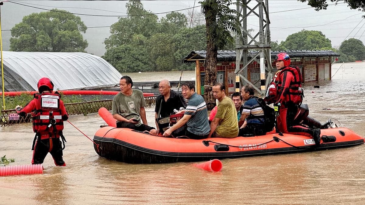 Floods from waning typhoon hit transport, force evacuations in China