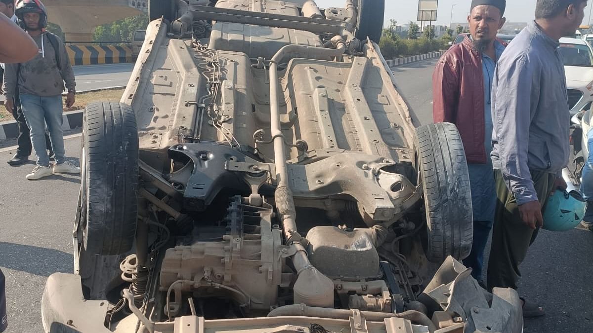 Car found toppled on Bagalur flyover  