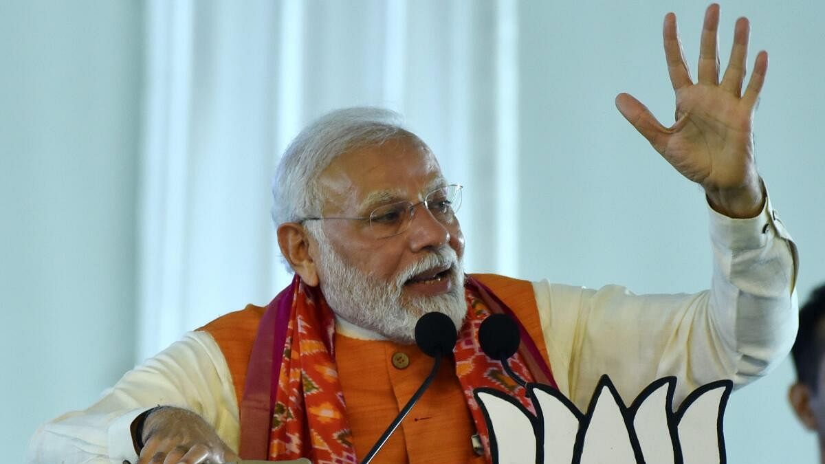 Prime Minister Narendra Modi speaks during a public meeting in Mahabubnagar district. 