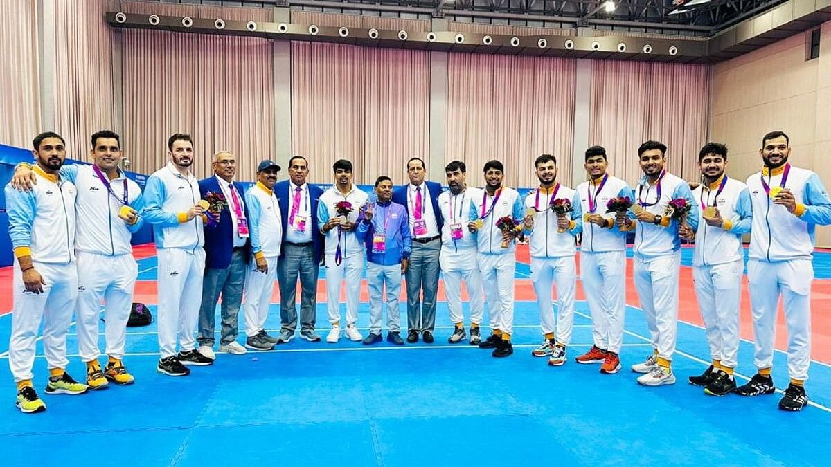 Indian men's kabaddi players sit on mat to protest referee's decision