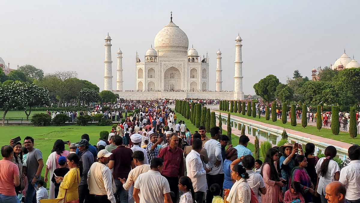 Tourists crowd the Taj Mahal during the long weekend owing to Gandhi Jayanti, in Agra. 