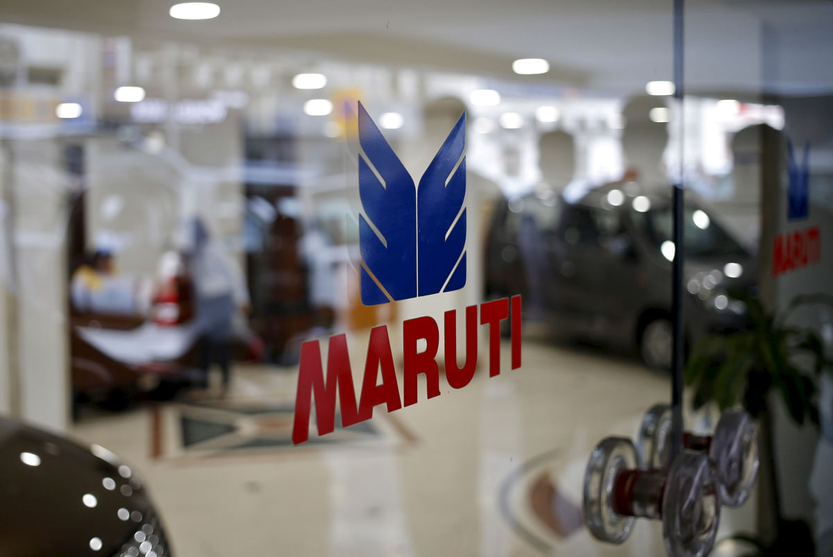 FILE PHOTO: The logo of Maruti Suzuki India Limited is seen on a glass door at a showroom in New Delhi India February 29 2016. REUTERS/Anindito Mukherjee//File Photo