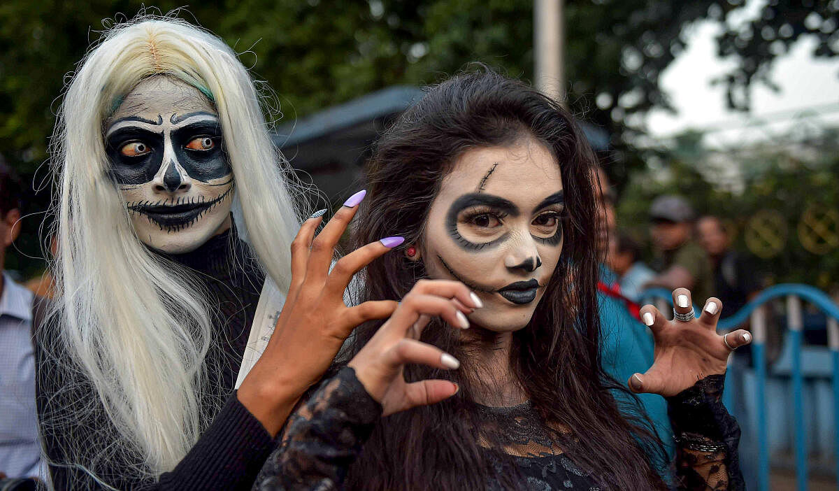  People participate in a Halloween festival, in Kolkata.