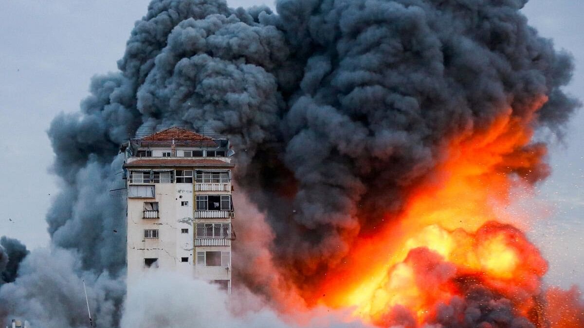 Smoke and flames billow after Israeli forces struck a high-rise tower in Gaza City.