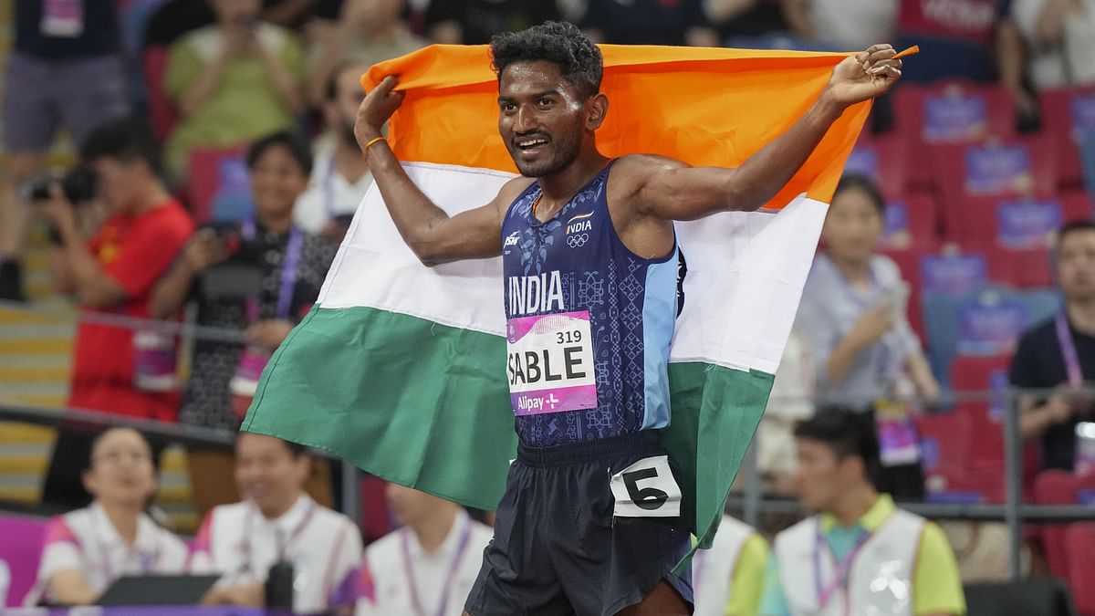 Avinash Mukund Sable celebrates after winning the men's 3000-meter steeplechase final. 