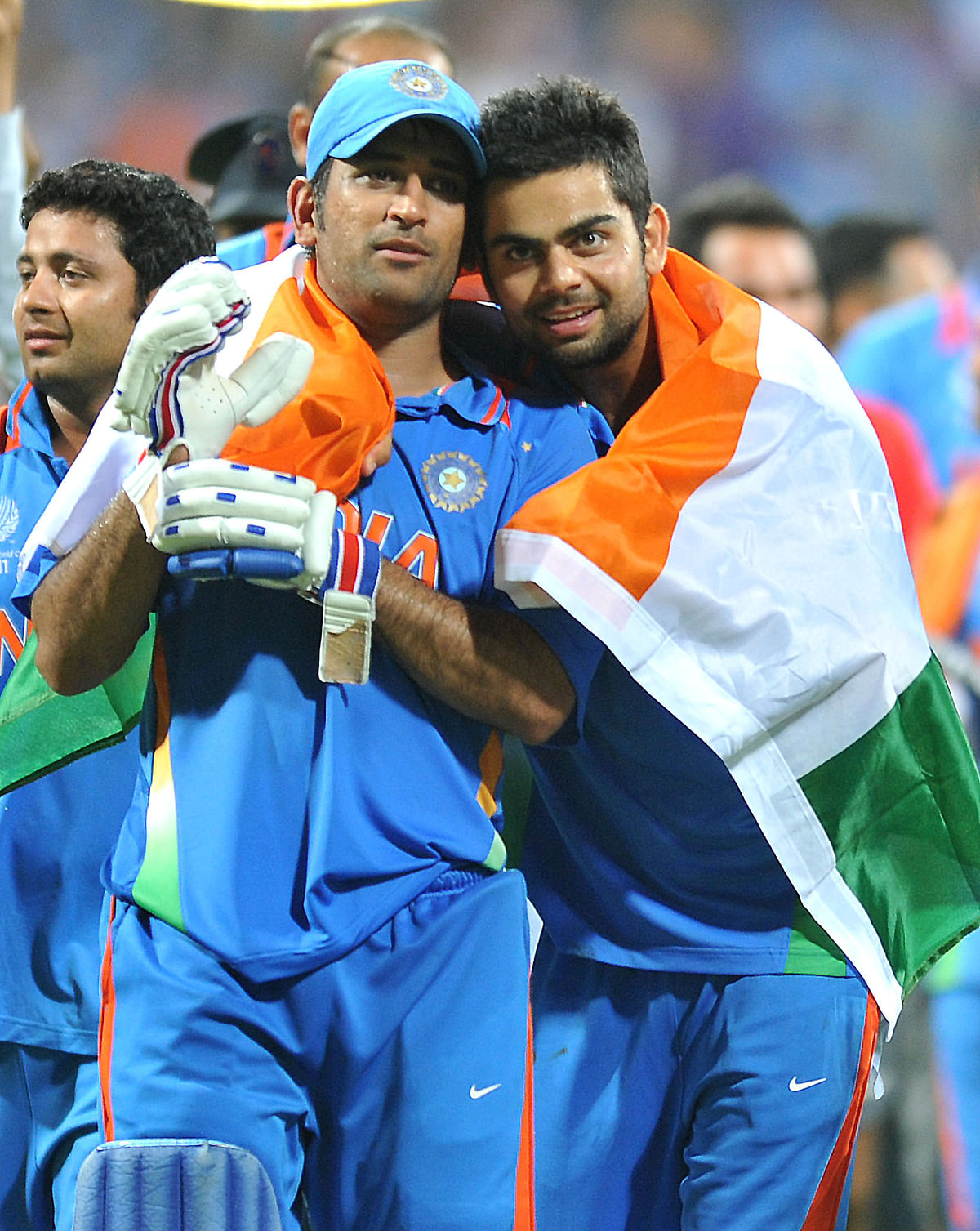 Top: MS Dhoni with a young Virat Kohli after winning 2011 World Cup at Wankade stadium in Mumbai. Arjuna Ranatunga (right) with the 1996 World Cup. DH File Photo