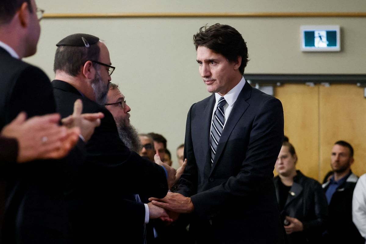 Canada's Prime Minister Justin Trudeau shakes hand with people attending a pro-Israel rally at the Soloway Jewish Community Centre in Ottawa.