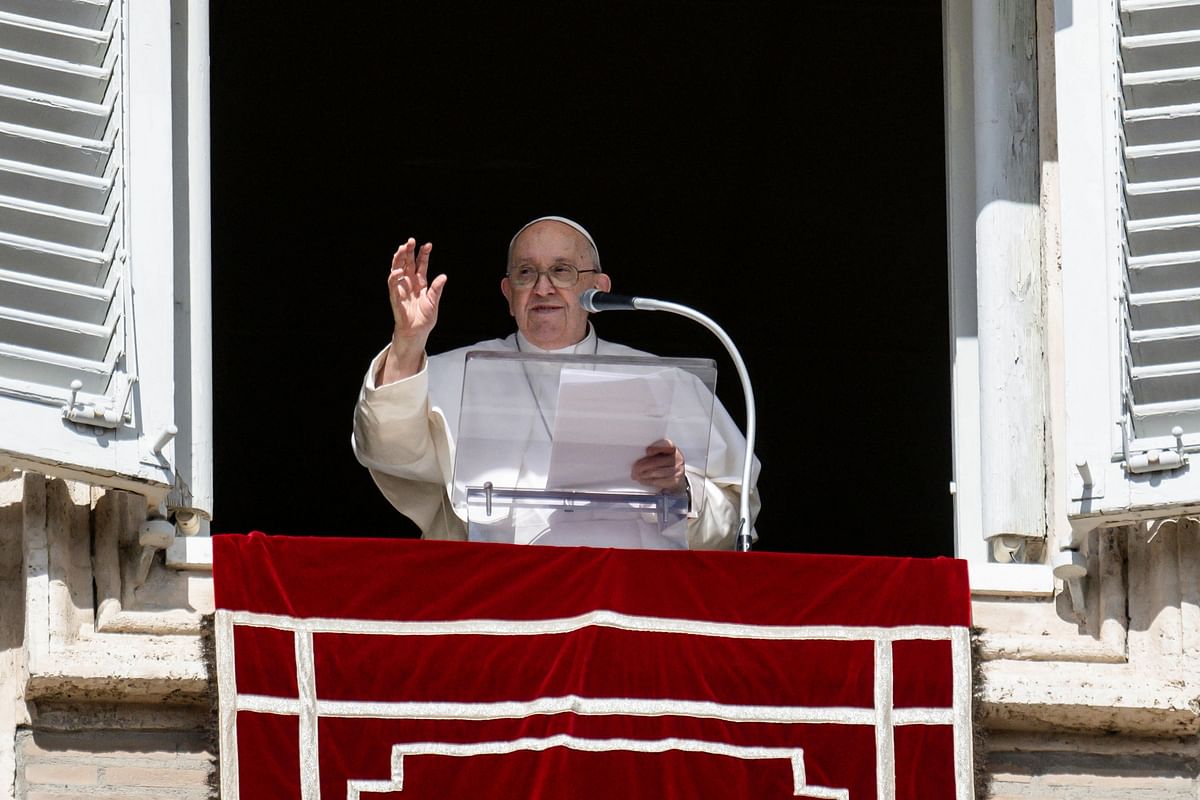 Pope Francis leads the Angelus prayer from his window at the Vatican, October 22, 2023.