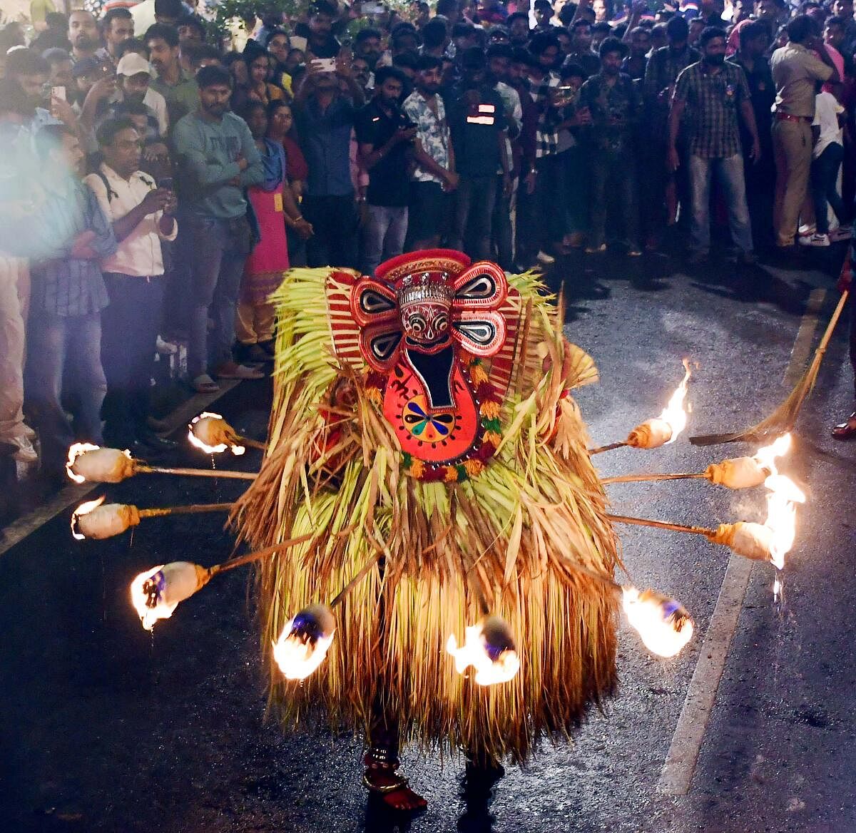 An artist performs 'Agnithira Theyyam' during the Keraleeyam festival, in Thiruvananthapuram.