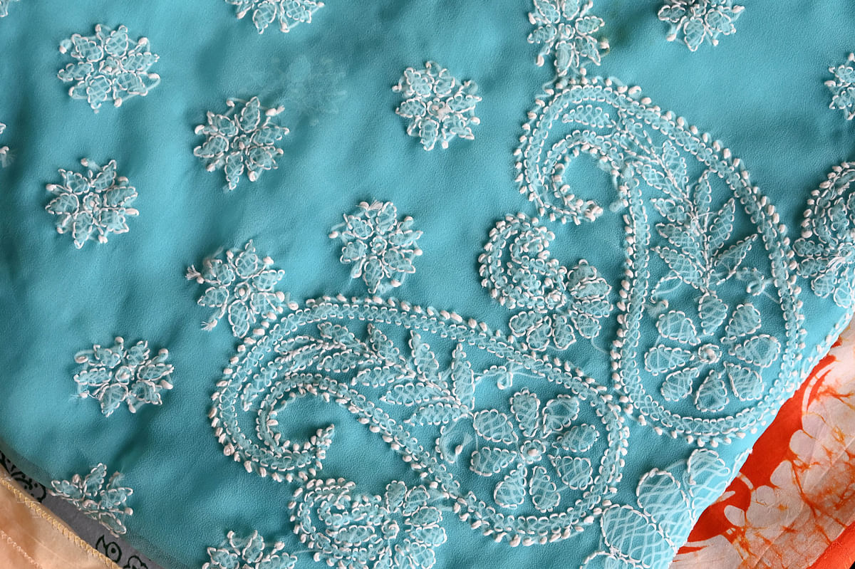 This blue chikankari sari was given by the author's best friend who was moving abroad.  Since she could pack pack fewer things, she passed on this as a keepsake.
