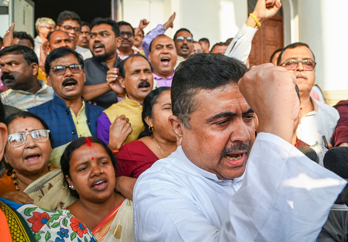 Leader of Opposition of West Bengal Assembly Suvendu Adhikari with BJP MLAs raise slogans during a protest against the state government during State Assembly session, in Kolkata.