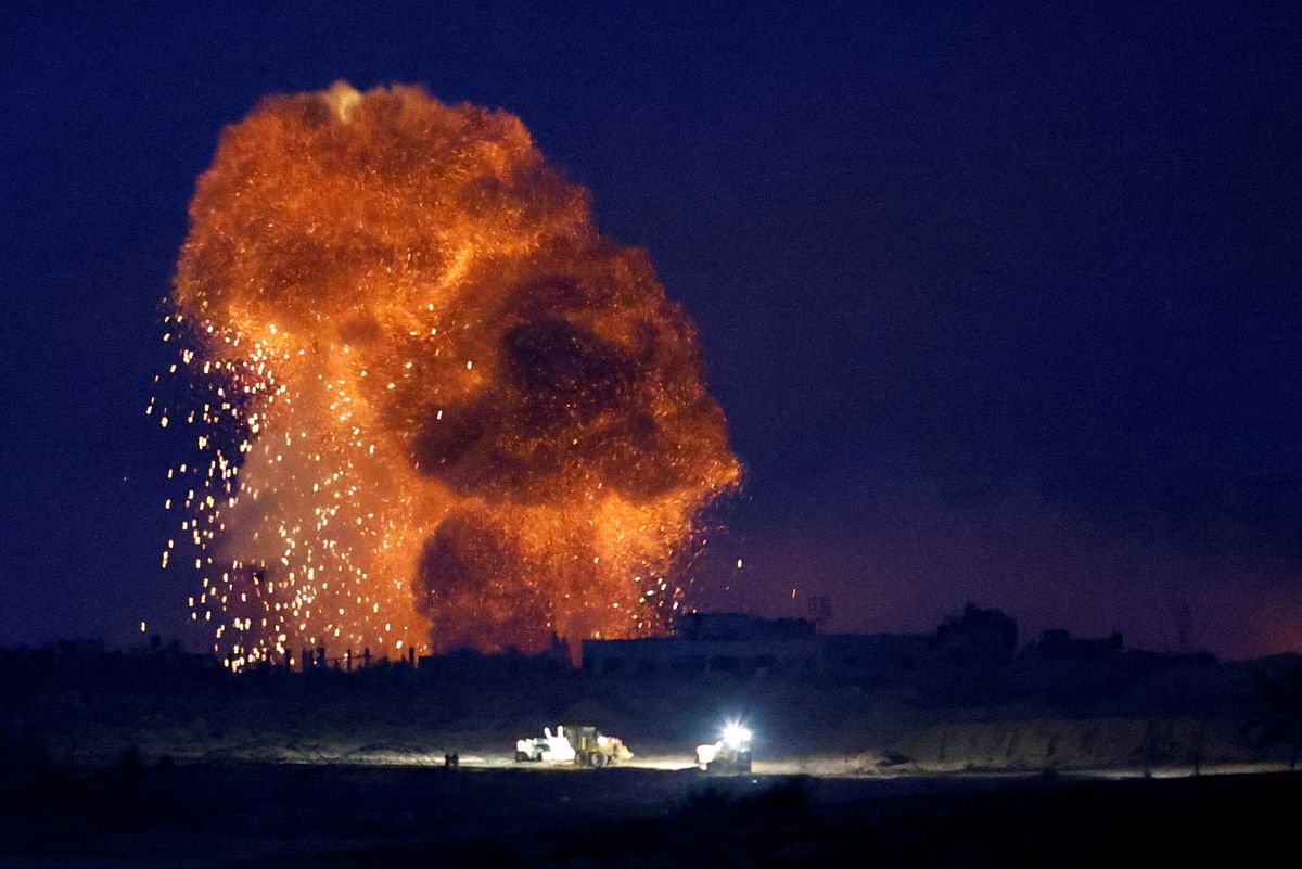 An explosion takes place during Israeli air strikes over Gaza, as seen from southern Israel, amid the ongoing conflict between Israel and the Palestinian group Hamas, November 22, 2023. 