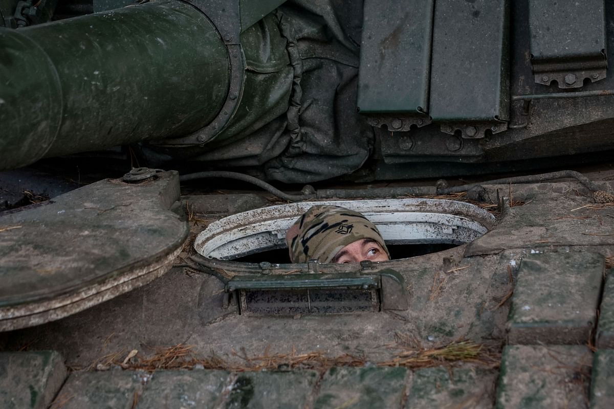 A serviceman of the 4th Separate Tank Brigade of the Armed Forces of Ukraine sits in a T-72 main battle tank, amid Russia's attack on Ukraine, near a frontline, in an undisclosed location in Donetsk region, Ukraine November 23, 2023. 