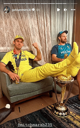 Mitchell Marsh with his legs on theWorld Cup Trophy.