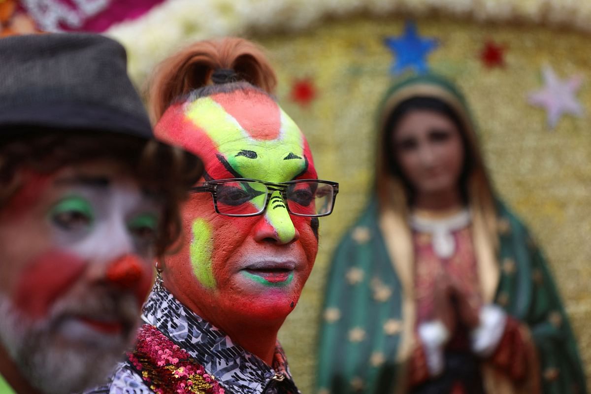 Clowns take part in a procession to pay homage to Mexico’s patron saint, Our Lady of Guadalupe, at the Basilica of Our Lady of Guadalupe in Mexico City.