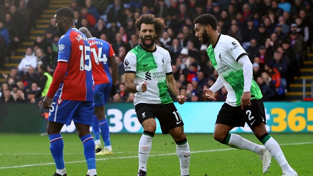 Salah nets 200th goal for Liverpool as Reds go top with 2-1 win over 10-man Palace