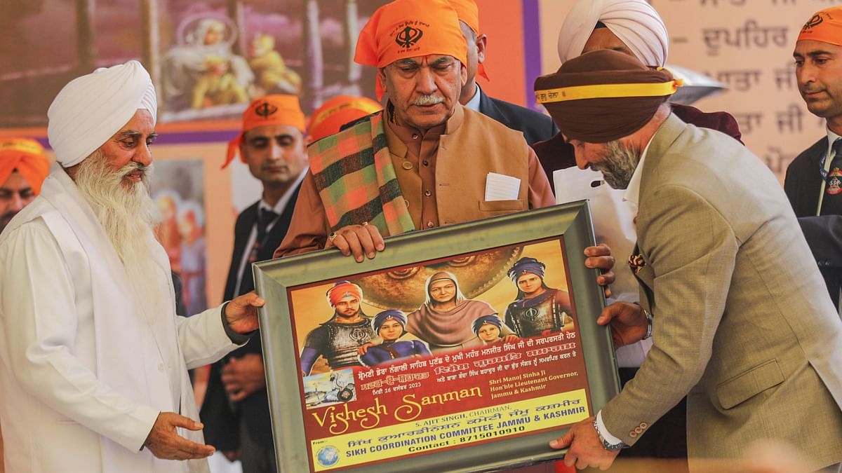 Jammu and Kashmir Lt Governor Manoj Sinha being felicitated during a programme on Veer Bal Diwas commemorating the martyrdom of two sons of Guru Gobind Singh, in Jammu, Tuesday, Dec. 26, 2023. 