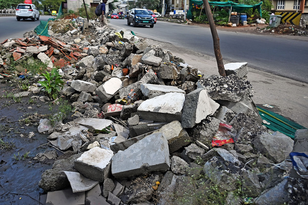Concrete debris dumped beside a road in Koramangala. Such scenes are common across Bengaluru as the city lacks aggregation centres for C&amp;D waste. 