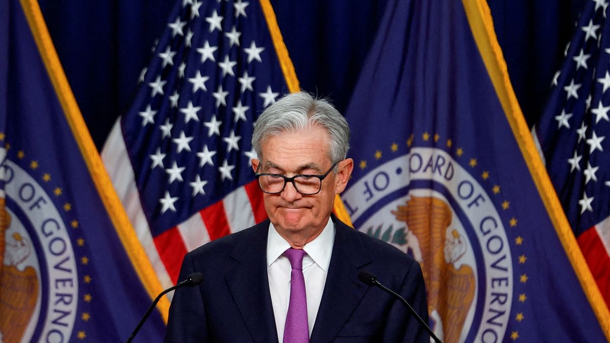 Fed officials leave rates unchanged and forecast three cuts next year