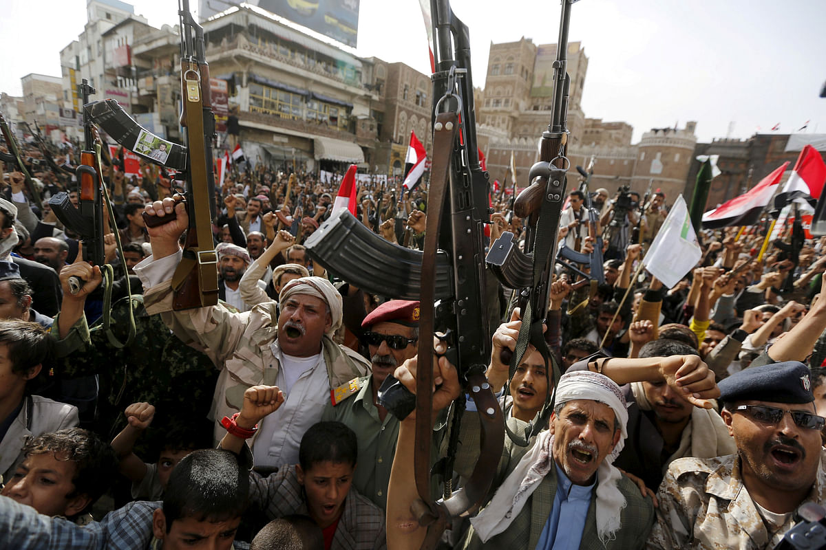 File Photo: Armed Houthi rebels rally against Saudi-led air strikes in Sanaa, June 14, 2015.