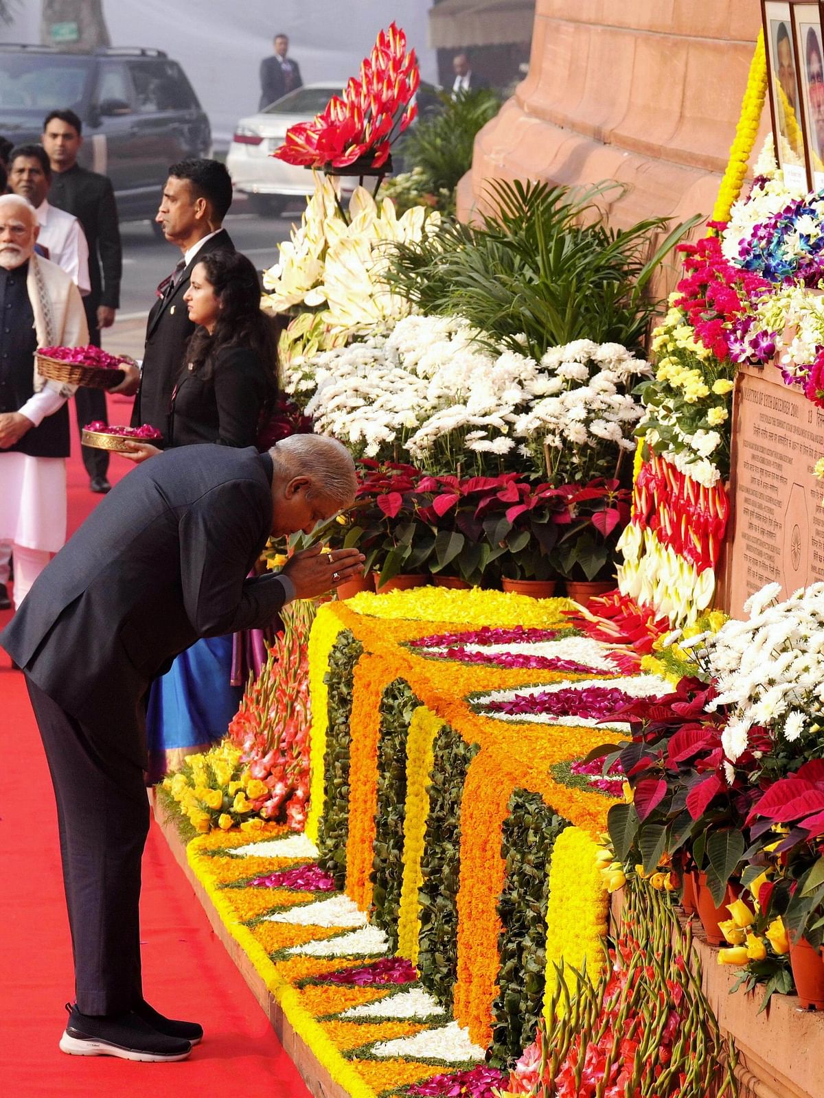 Vice President Jagdeep Dhankhar pays floral tribute to the martyrs who lost their lives in the 2001 Parliament attack during a tribute ceremony at the Samvidhan Sadan, in New Delhi.