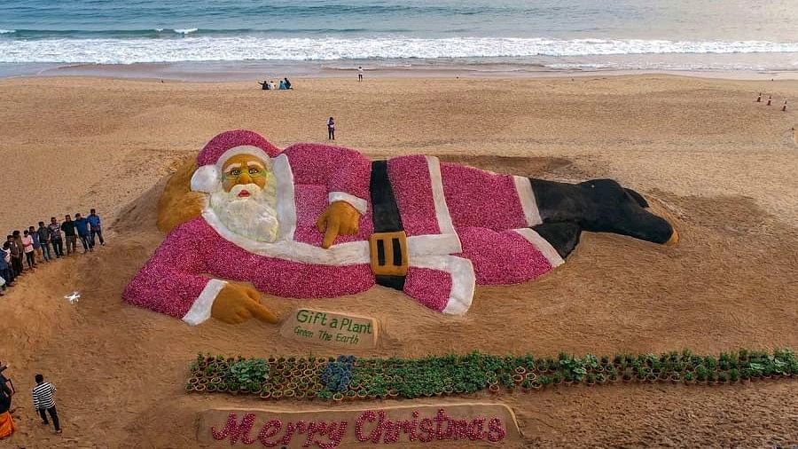 Santa Claus sculpture created with sand, onions on Puri Beach