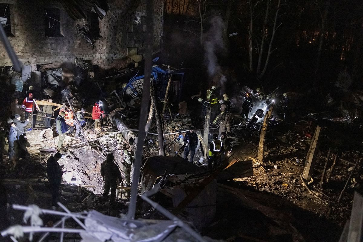 Firefighters and police investigators work at the site of a Russian missile strike, amid Russia's attack on Ukraine, in Kharkiv, Ukraine December 30, 2023. REUTERS/Yevhen Titov