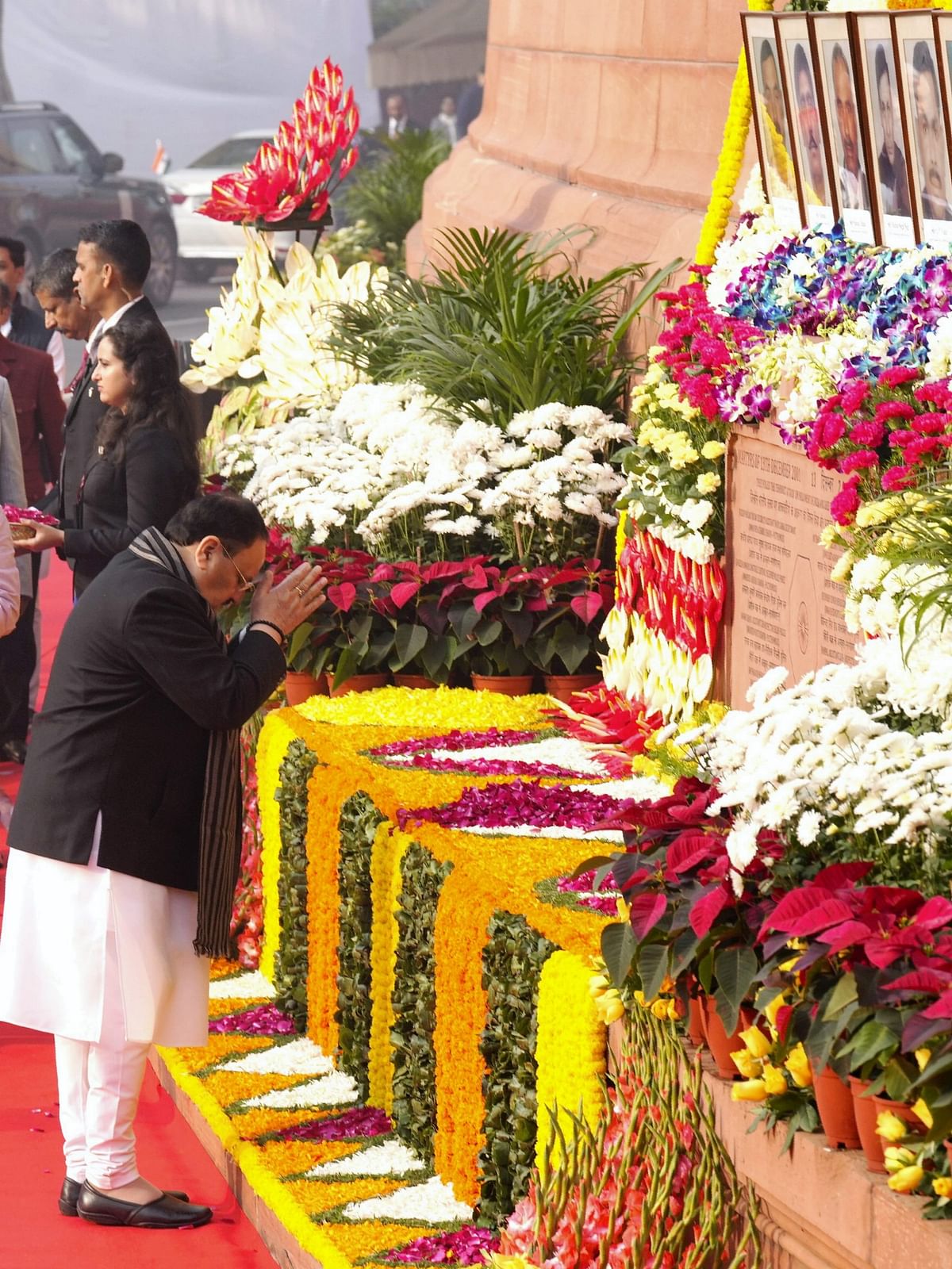 BJP National President J P Nadda pays floral tribute to the martyrs who lost their lives in the 2001 Parliament attack, during a tribute ceremony at the Samvidhan Sadan.