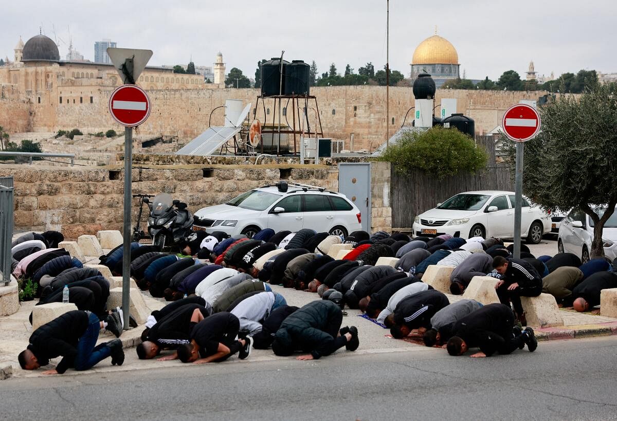 Palestinian Muslims hold Friday prayers, as the conflict between Israel and the Palestinian Islamist group Hamas continues, in Jerusalem, December 29, 2023. 