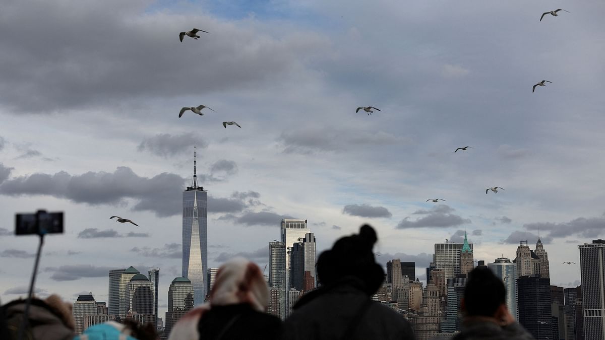 One World Trader Center stands in Lower Manhattan as people watch aboard the Staten Island Ferry in New York City. 