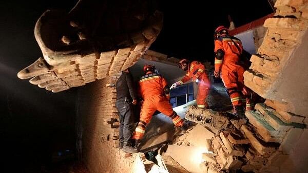 Rescue workers struggle to help China quake survivors in freezing conditions