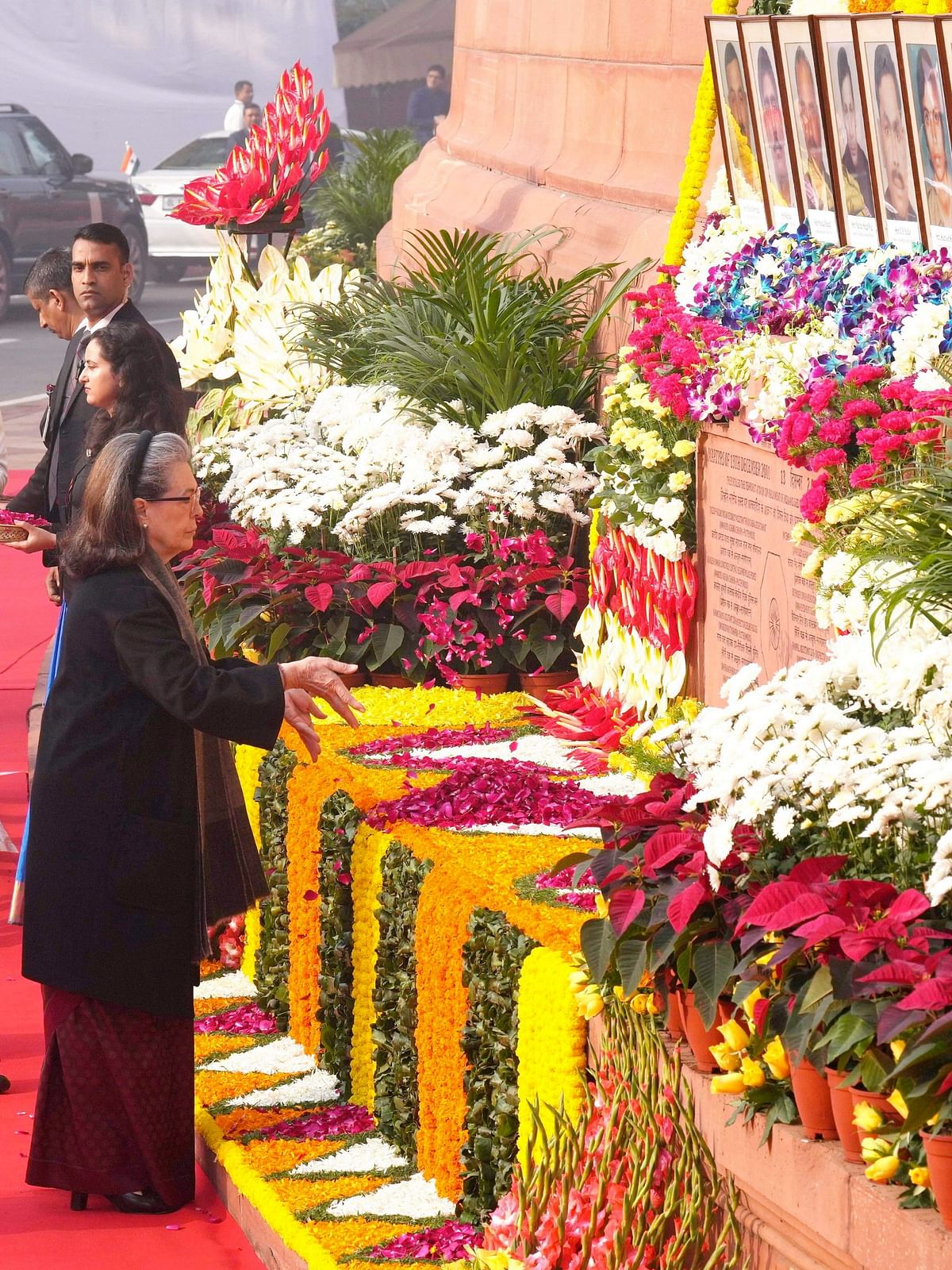 Congress leader Sonia Gandhi pays tribute to martyrs who lost their lives in 2001 Parliament attack to mark its 22nd anniversary, at the Parliament House in New Delhi.