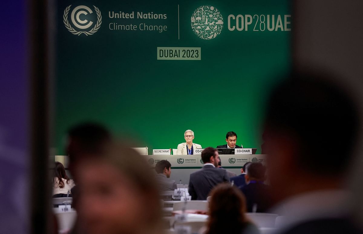 Delegates meet on the day of COP28 draft deal negotiations, during the United Nations Climate Change Conference (COP28) in Dubai, United Arab Emirates.