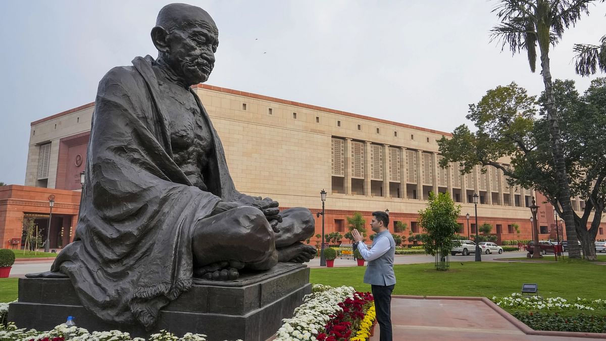 AAP MP Raghav Chadha pays tribute to Mahatma Gandhi after his suspension was revoked by Rajya Sabha Chairman Jagdeep Dhankhar on the first day of Winter session of Parliament, in New Delhi, Monday, Dec. 4, 2023. 