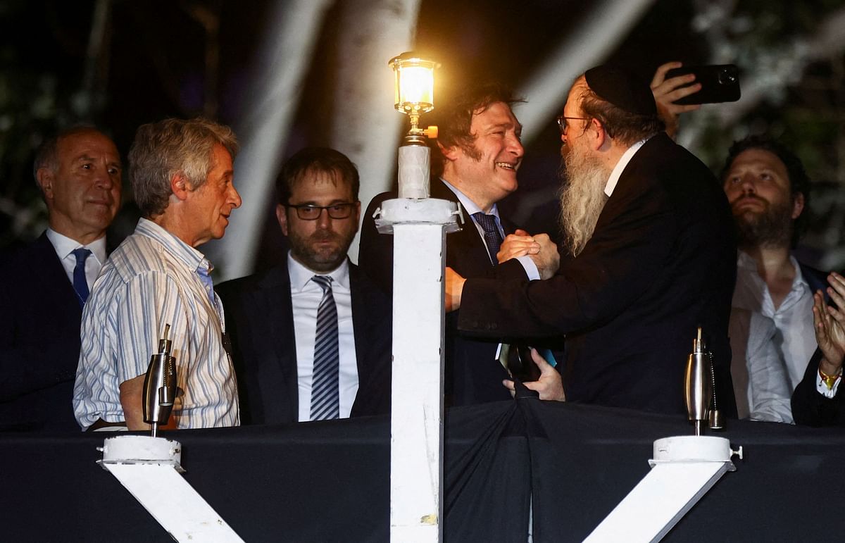 Argentina's President Javier Milei shakes hand with Rabbi Tzvi Grunblatt following the lightening of a menorah during a Hanukkah celebration in Buenos Aires, Argentina.