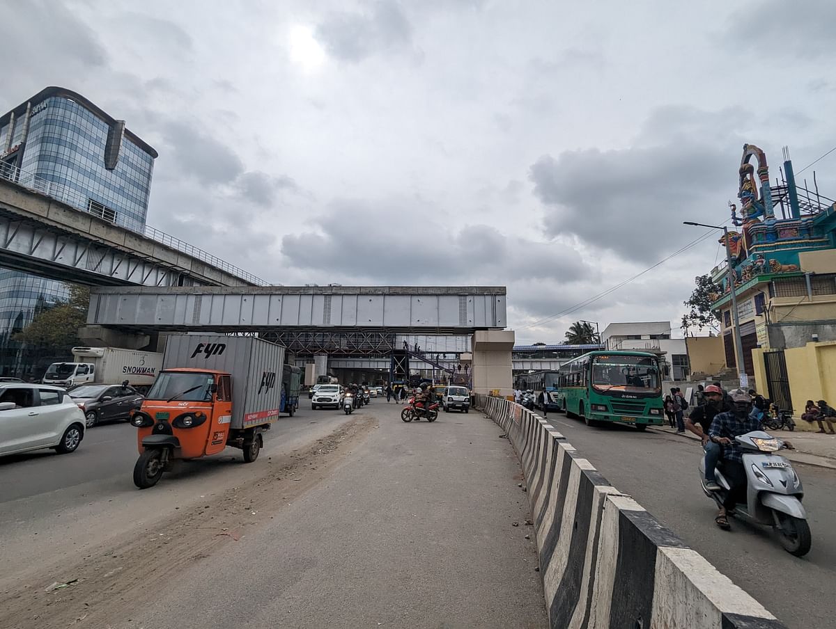 Traffic police have barricaded entry to the bus stop at the mouth of the KR Puram hanging bridge and shifted it to just below the skywalk about 100 metres behind. 