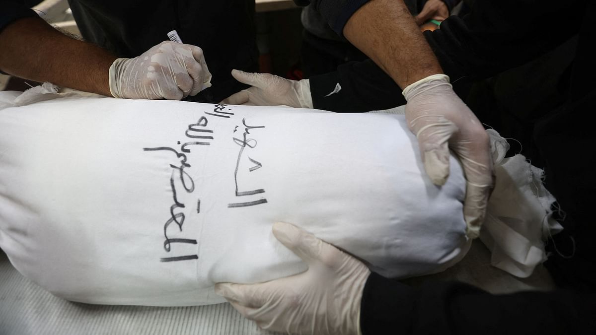 In Gaza, rows of white shrouds symbolise mounting civilian deaths