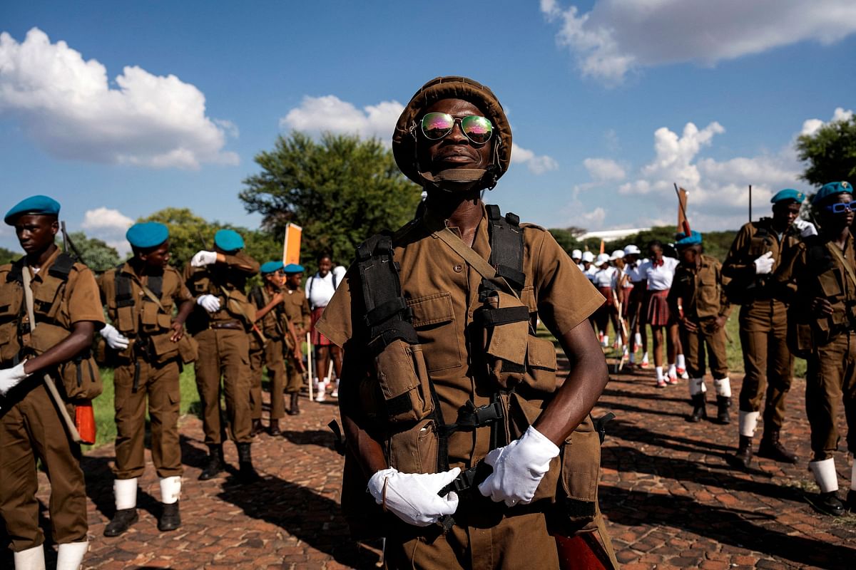 Civilians dressed up in creative, military-style uniforms, march in honour of the Black African soldiers who were conscripted into the South African army to fight in World War I, during the Diturupa Festival in Mabopane, South Africa January 2, 2024.